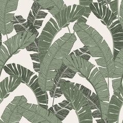 Feuilles tropicales vertes dessinant un motif sans couture.