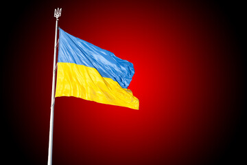 Ukrainian flag on a flagpole. The war in Ukraine.