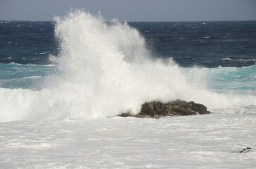 Wave breaking against the shore. El Confital. La Isleta Protected Landscape. Las Palmas de Gran Canaria. Gran Canaria. Canary Islands. Spain.