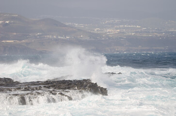 Waves breaking against the shore. El Confital. La Isleta Protected Landscape. Las Palmas de Gran Canaria. Gran Canaria. Canary Islands. Spain.