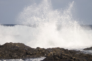 Waves breaking against the shore. El Confital. La Isleta Protected Landscape. Las Palmas de Gran Canaria. Gran Canaria. Canary Islands. Spain.