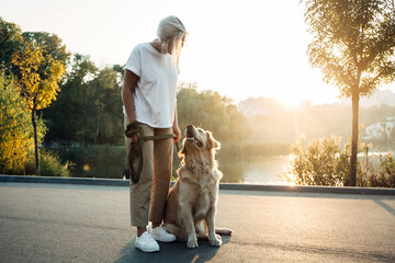 Girl with golden retriever in the park