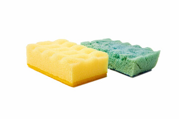 New and old, dishwashing foam sponges isolated on white background. Yellow and green sponges. Close-up photo.
