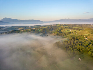 Morning fog in the Ukrainian Carpathians. Aerial drone view.