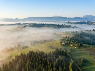 Morning fog in the Ukrainian Carpathians. Aerial drone view.