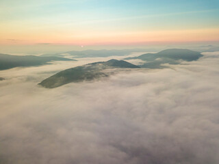 Morning fog in the Ukrainian Carpathians. Aerial drone view.