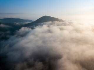 Morning fog in the Ukrainian Carpathians. Aerial drone view.
