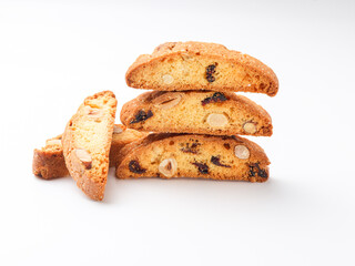 cantuccini cookies with almonds and raisins on white background 