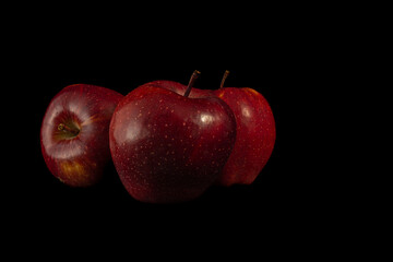 Three juicy red apples