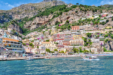 Naklejka premium Amalfi coast, Italy - July 01 2021: View of the village of Positano along the Amalfi Coast in Italy, with its characteristic colorful houses