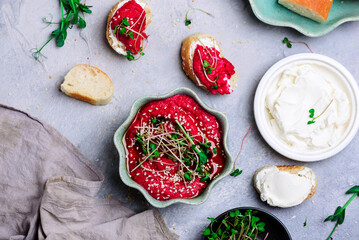 Beetroot hummus with micro greens. top view .