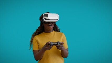 Cheerful young woman in VR headset playing video game by console, application
