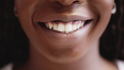Fototapeta premium Beautiful african woman smiling, healthy teeth, dental care, whitening system
