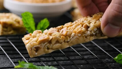 Taking Peanuts butter Cereal Bars with nuts, oat and honey. Healthy Protein snack