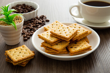 Biscuit with chocolate filling on wooden background