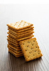 Biscuit with chocolate filling on wooden background