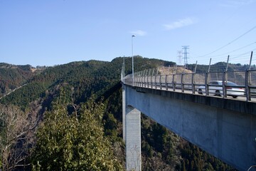 The Shintabiashi bridge and view of Japanese mountains in Gifu.