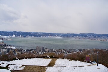The view of Lake Suwa from Tateishi Park in winter at Nagano.