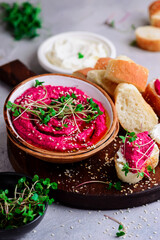 Beetroot hummus with micro greens. top view .