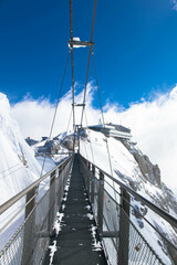 Fototapeta premium Austrias highest suspension bridge in the austrian Alps. Skywalk on Dachstein. Schladming, Styria, Austria 