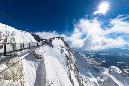 Austrias highest suspension bridge in the austrian Alps. Skywalk on Dachstein. Schladming, Styria, Austria 
Spectacular winter landscape and breathtaking views.