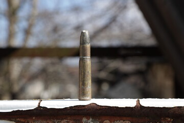 Old rifle cartridge on the ground