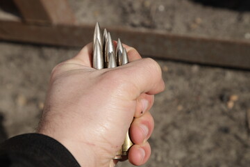 Vintage cartridges for a gun in hand