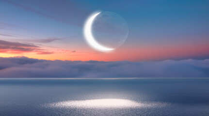 Fototapeta na wymiar Ramadan Concept - Abstract background with Crescent moon over the sunset clouds
