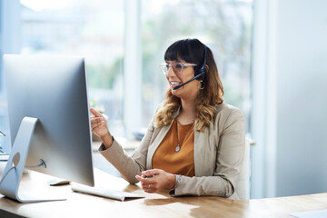 I have a solution for you. Cropped shot of an attractive young businesswoman sitting and using a headset in her office during the day.