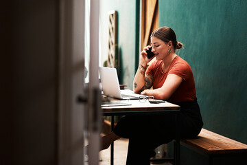 I always follow up on my clients. Cropped shot of an attractive young businesswoman sitting alone...