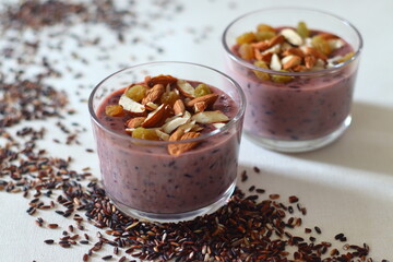 Black rice pudding. Made with black rice simmered in milk, sweetened with sugar and flavored with cardamom