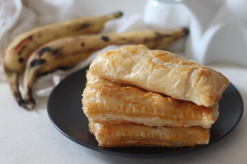 Plantain puff. Ripe plantain slices wrapped in a puff pastry sheets and baked until crisp
