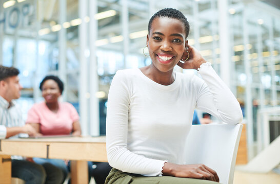 We Do It Better When We Do It Together. Shot Of A Young Businesswoman Having A Meeting With Her Team In A Modern Office.