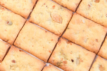 Bright rectangular cracker with pumpkin seeds, top view