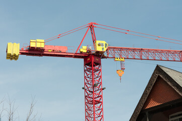 construction site with crane (and detail of old house)