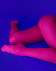 Woman in pink tights on blue background euphoria style