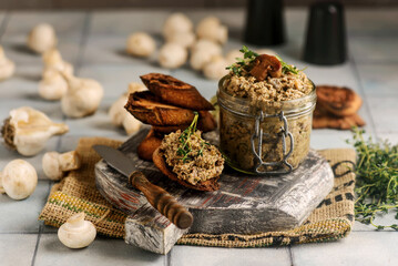 Mushroom pate in a glass jar with toast. rustic style - obrazy, fototapety, plakaty