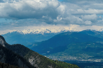 Obraz premium Mountain peak of Hahnkogel (Klek) with panoramic view in spring on the Karawanks, Carinthia, Austria. Borders Austria, Slovenia, Italy. Hohe Tauern Mountain Range. Alpine meadows