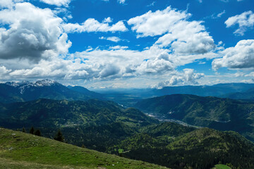 Panoramic view from Frauenkogel on mountain peaks in the Karawanks and Julian Alps, Carinthia, Austria. Borders Austria, Slovenia, Italy. Triglav National Park. Alpine meadows in spring. Woodland