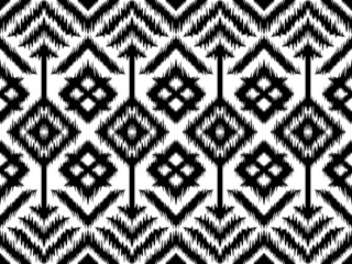 Ethnic Ikat Geometric oriental pattern on fabric in Indonesia and other Asian countries design for background and wallpaper. Seamless striped pattern in Aztec style. Folk embroidery.