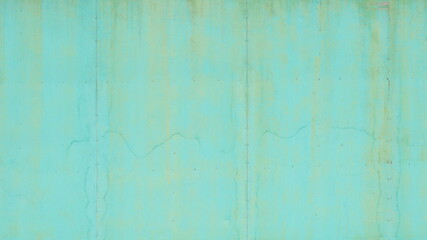 Old wall background painted turquoise. Soft focus