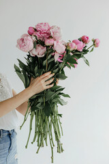 Bouquet of stylish flowers. Romantic composition with pink flowers. Pastel plants composition