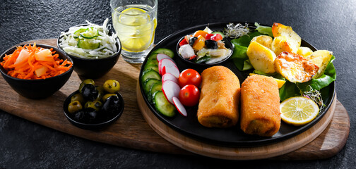 Breaded and deep-fried croquettes with potatoes and vegetables