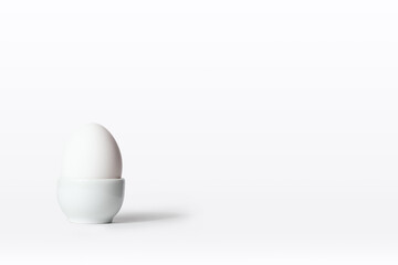 Egg in stand. All in white.