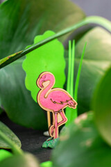 Craft flamingos in the tropics