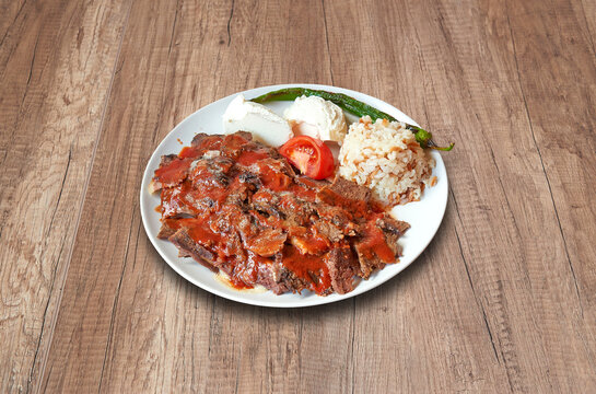 Iskander and vegetables on wooden table