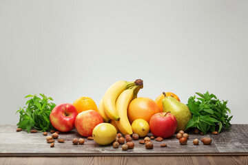 Mix of healthy fruits on the table. Photo of food on a dark background