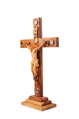 Wooden crucifix standing isolated on white background.