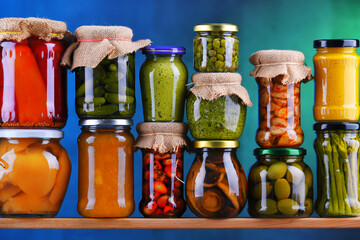 Jars with variety of pickled vegetables and fruits