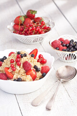 Breakfast oatmeal with fruits, sweets. food photography, dark background
